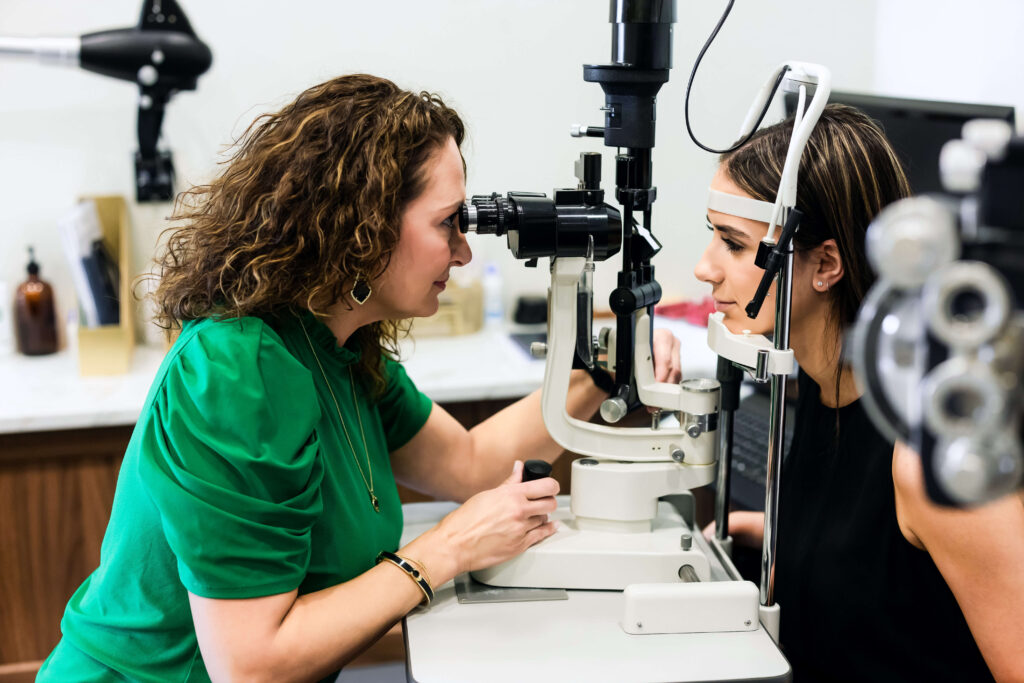 Dr. Sylvia Thoman with patient testing eyesight