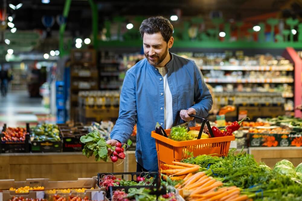 man picking out healthy, fresh produce