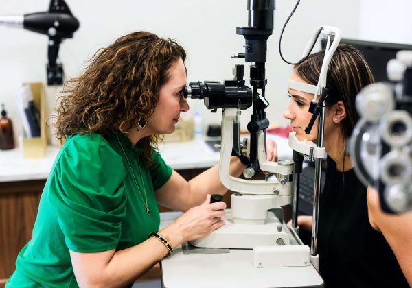 Dr. Sylvia Thoman with patient testing eyesight