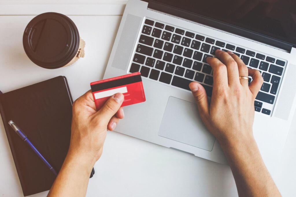 man using credit card for online payment