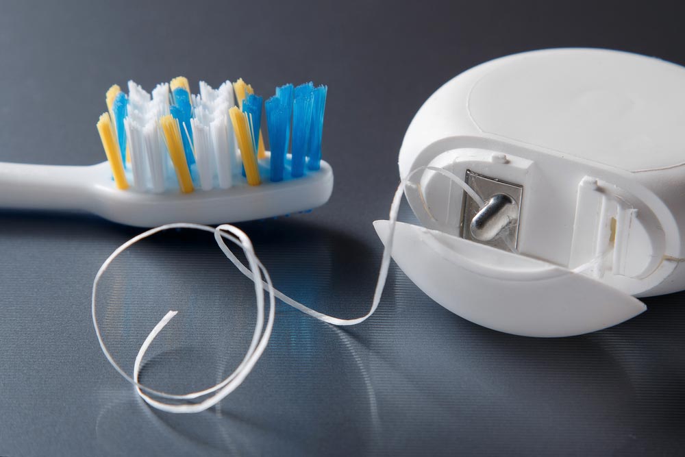 toothbrush and dental floss