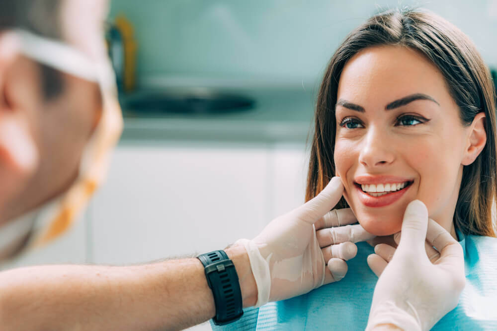 Young smiling woman with beautiful teeth