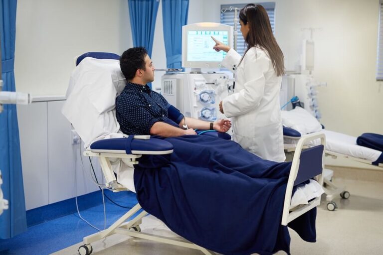Man and female doctor with dialysis machine in hospital for kidney assessment