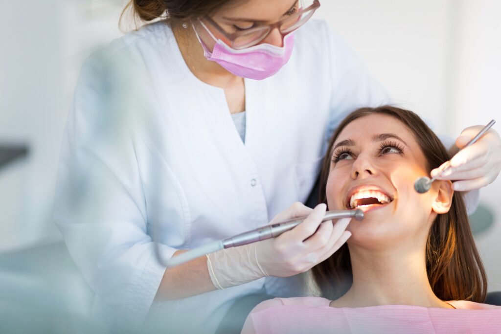 pretty young woman sitting in dental chair