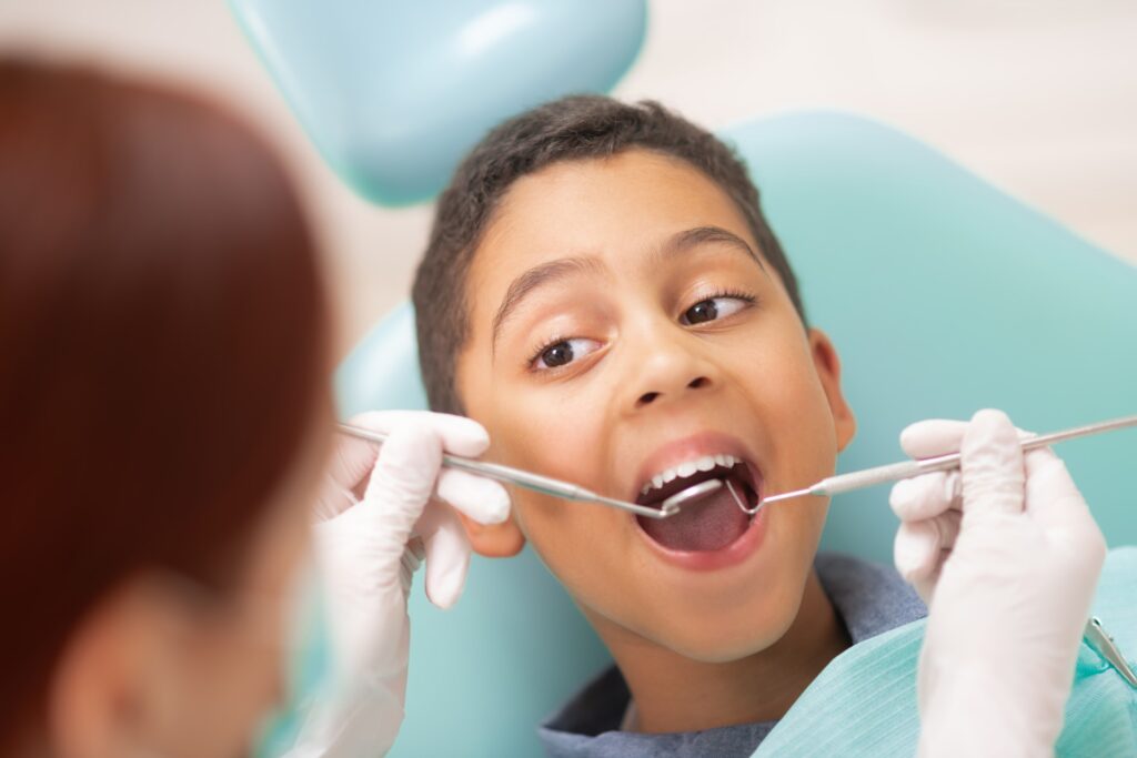 Kid having dental treatment in dental clinic