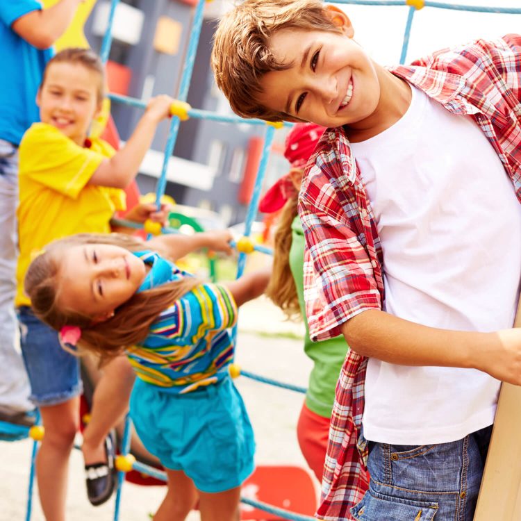 Image of joyful friends having fun on playground outdoors