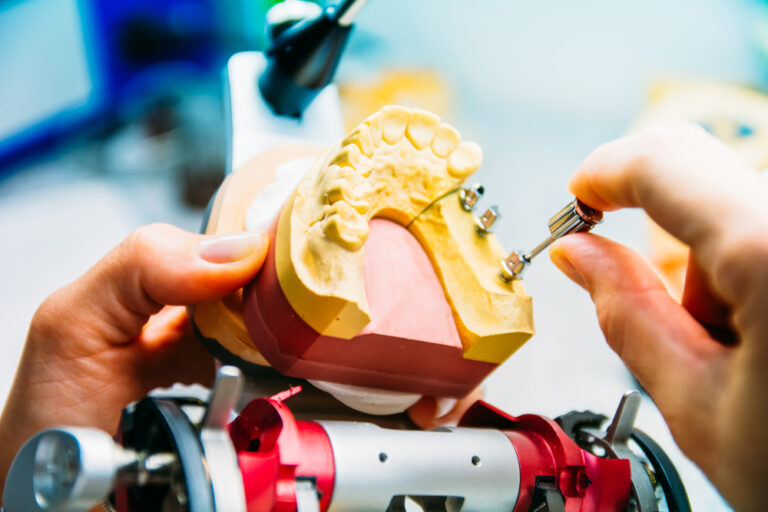 Maxillofacial prosthesis dentist in work