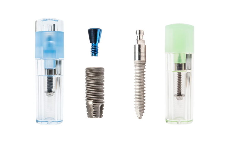 two types of dental Implant with container on white background