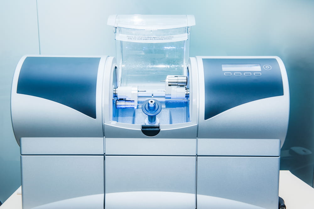 CAD CAM dental computer-aided machine in a highly modern dental laboratory for prosthesis and crowns milling.