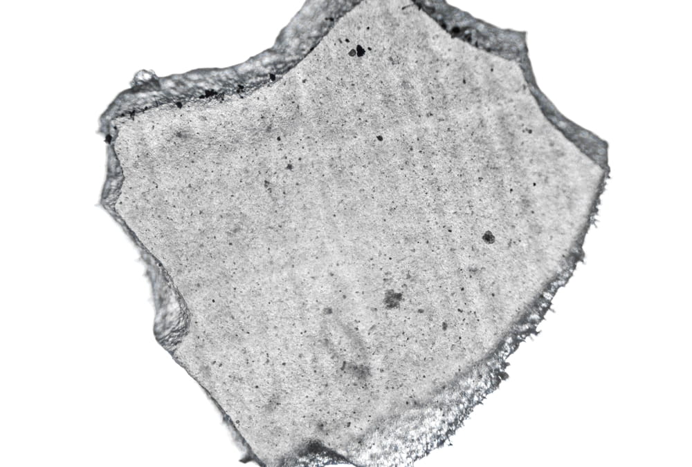 fragment of hybrid ceramic used in dentistry, macro photo using a microscope, magnification 40 times