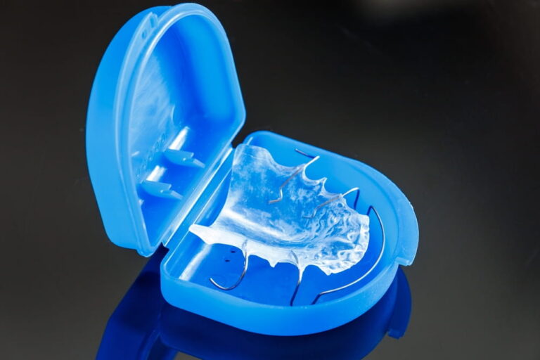 A removable orthodontic appliance in a box. Concept of pediatric dentistry, correcting the bite.