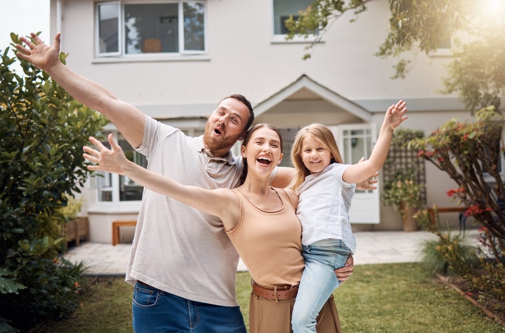 happy family in backyard at new house