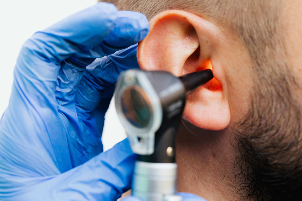 ENT doctor examining male patient