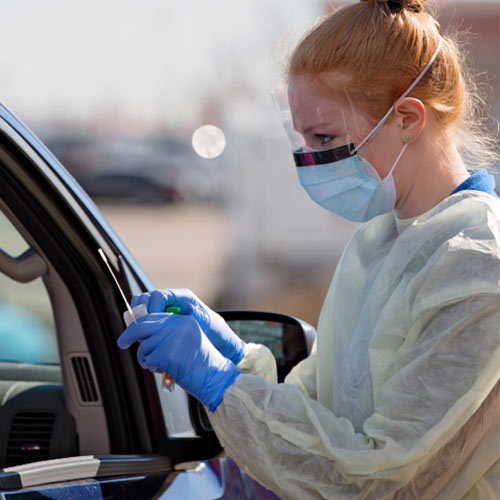 Medical worker taking a throat swab for test