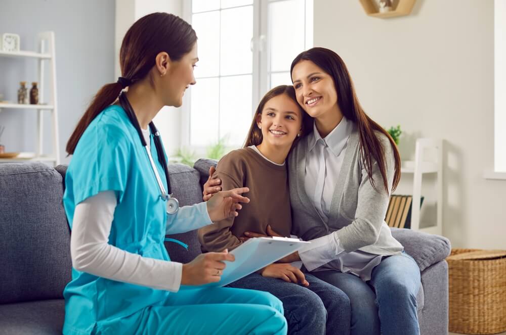 nurse with mom and child