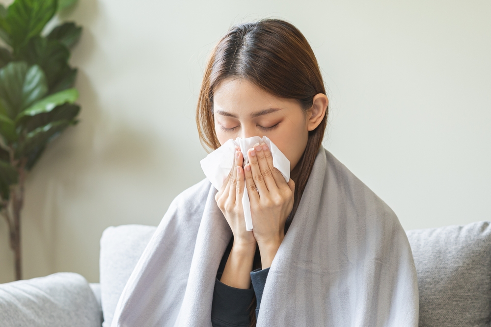 girl have a fever, flu and hand in use tissues paper sneezing nose