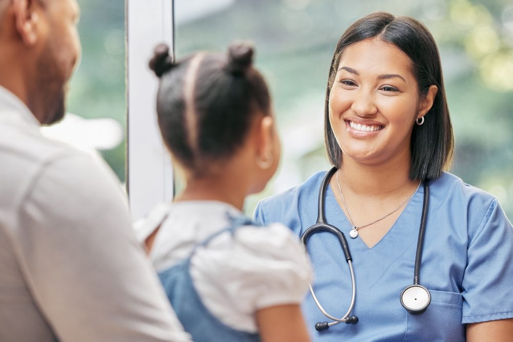 Father, child and nurse talking for health care in a hospital