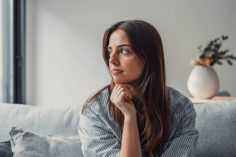 Sad woman sit alone thinking about personal problems