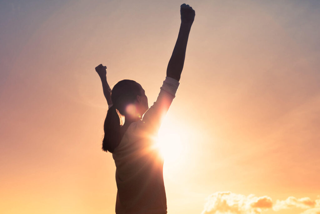 Strong woman with fist in the air