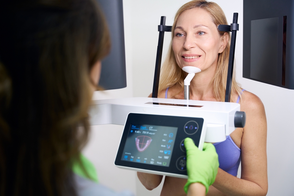 Adult woman receiving CBCT scan in dentistry clinic