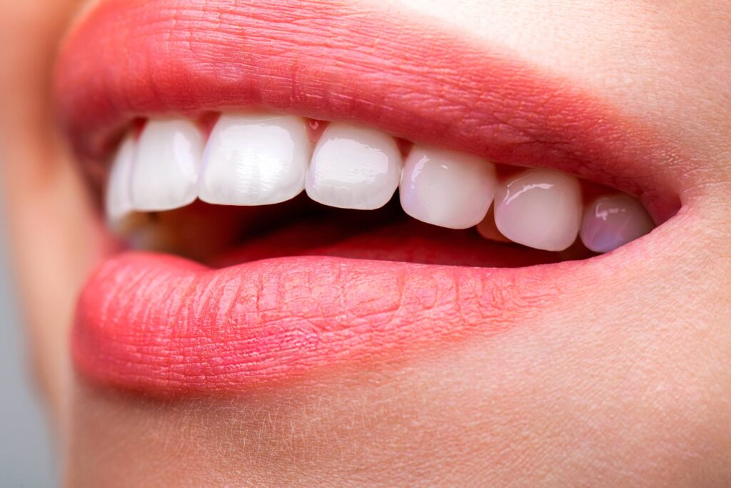 Beautiful young woman teeth. Teeth whitening. Dental health concept