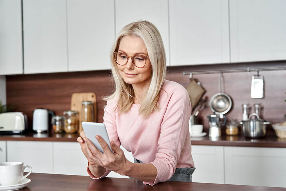 Middle aged woman using smart phone