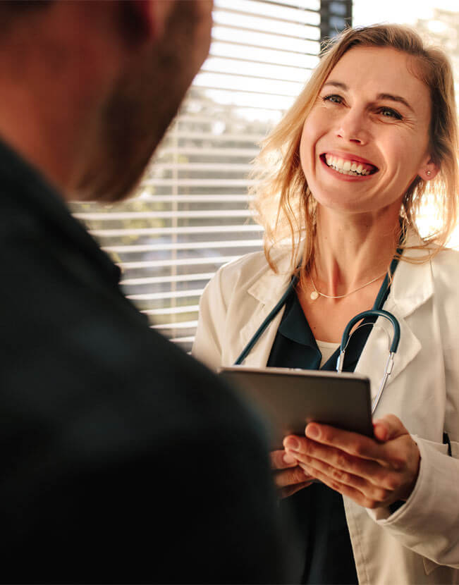 Female doctor consulting a patient in clinic