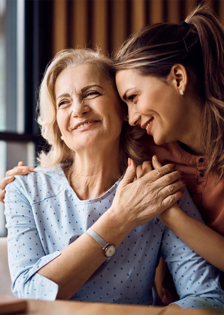 Happy senior woman enjoying in daughter's affection