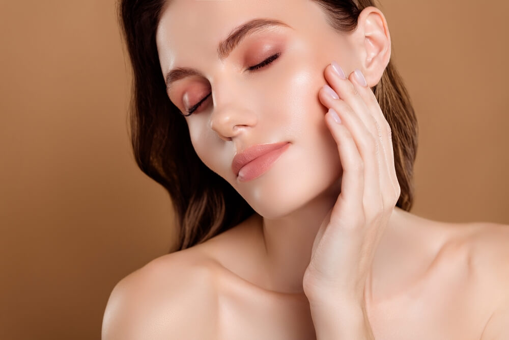 Photo of tender lady enjoy softness of face skin