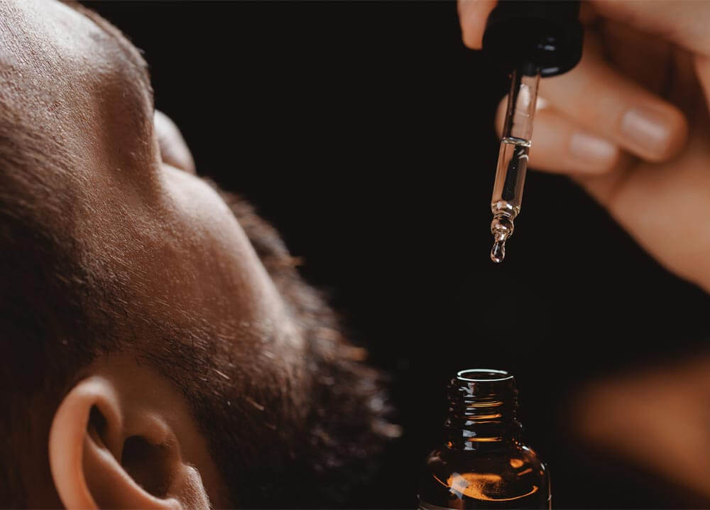 Oil for beard in dropper