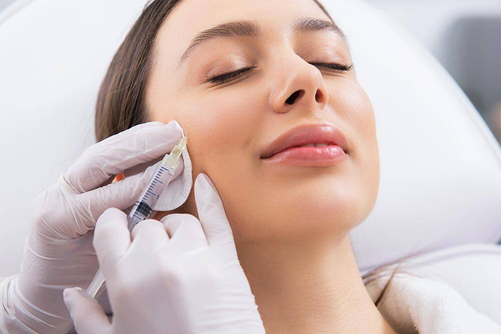 Woman getting Anti-aging face treatment