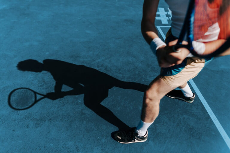 healthy athletic man with a tennis racket