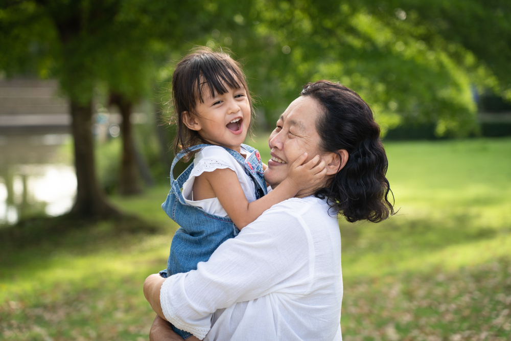 Adorable,Asian,Granddaughter,Is,Playing,And,Laughing,Together,With,Grandmother