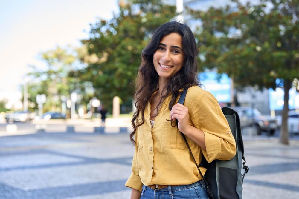 Beautiful girl student with backpack