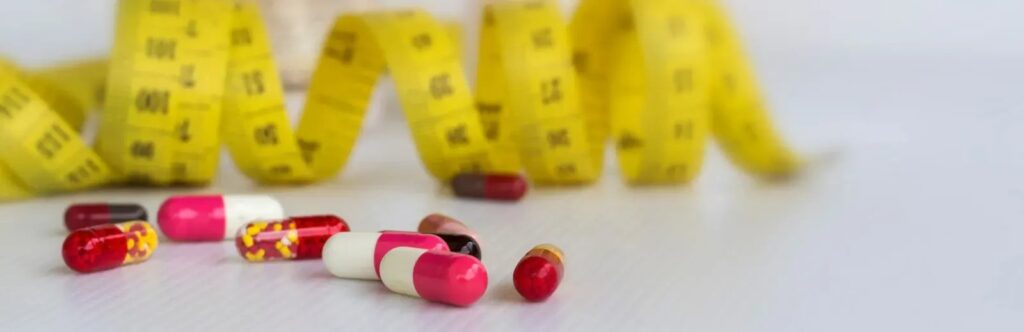 capsules and measuring tape