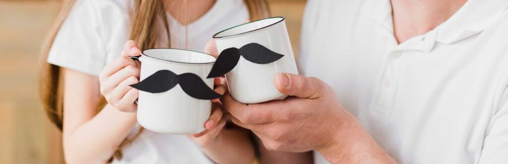 Couple holding coffee cup with Black mustache