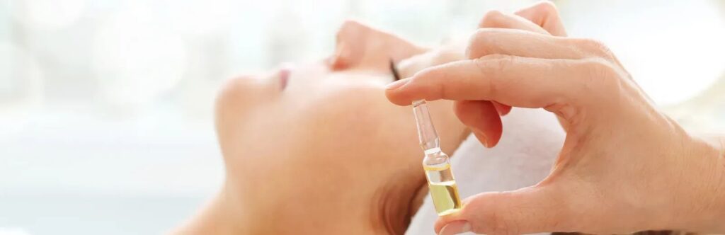 hands holding injection near patient