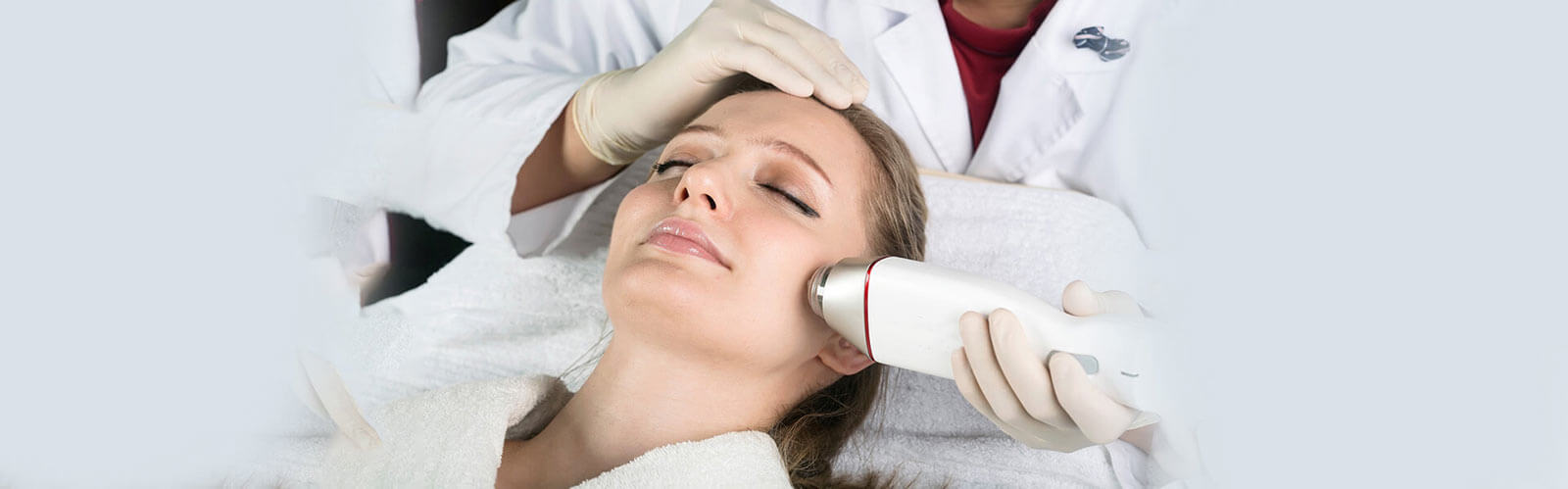 Woman getting face treatment