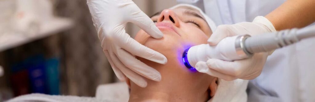 A young beautiful girl lies on the beautician's table and receives procedures
