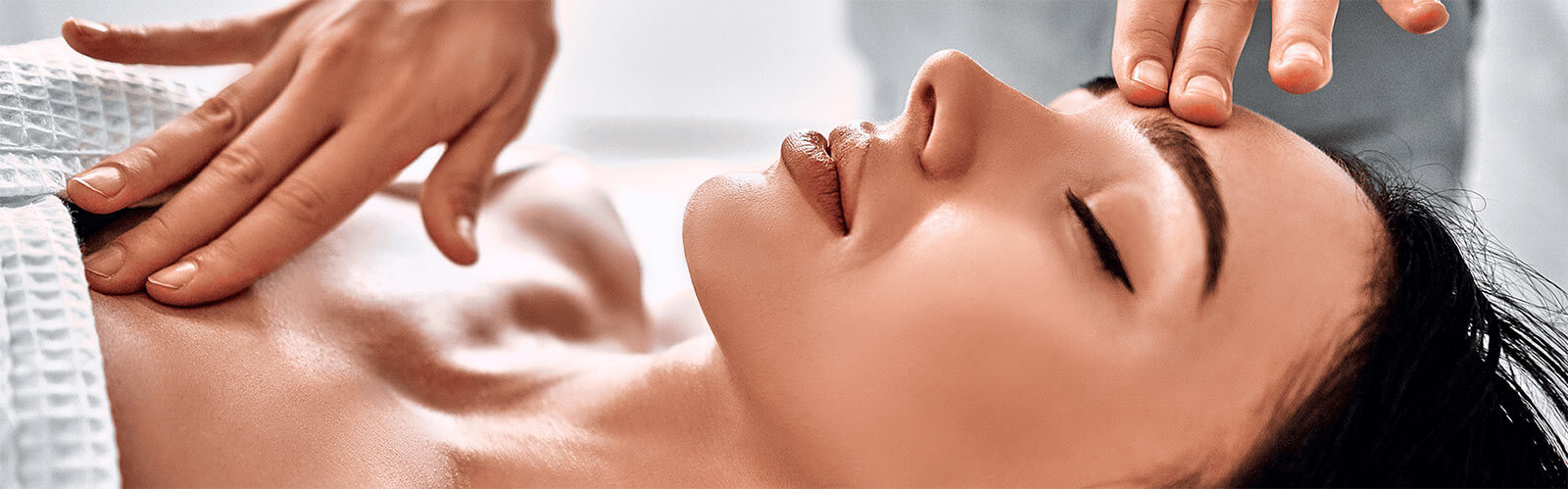Woman receiving massage from masseur at Spa salon
