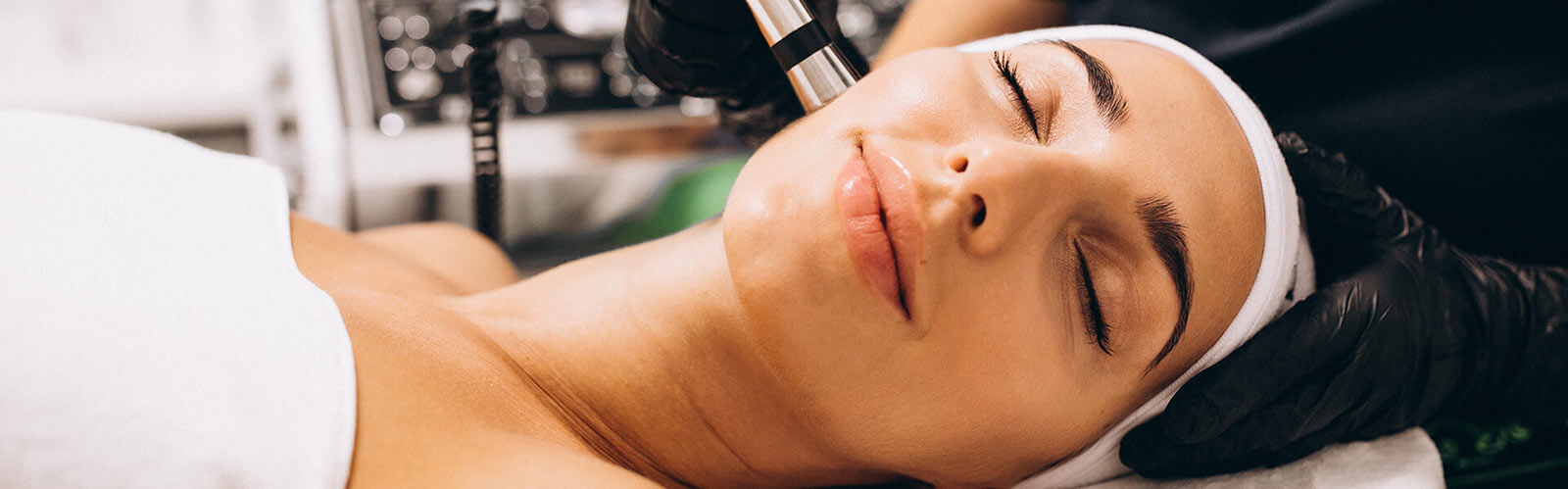 Woman receiving Skin Care treatment at Spa salon