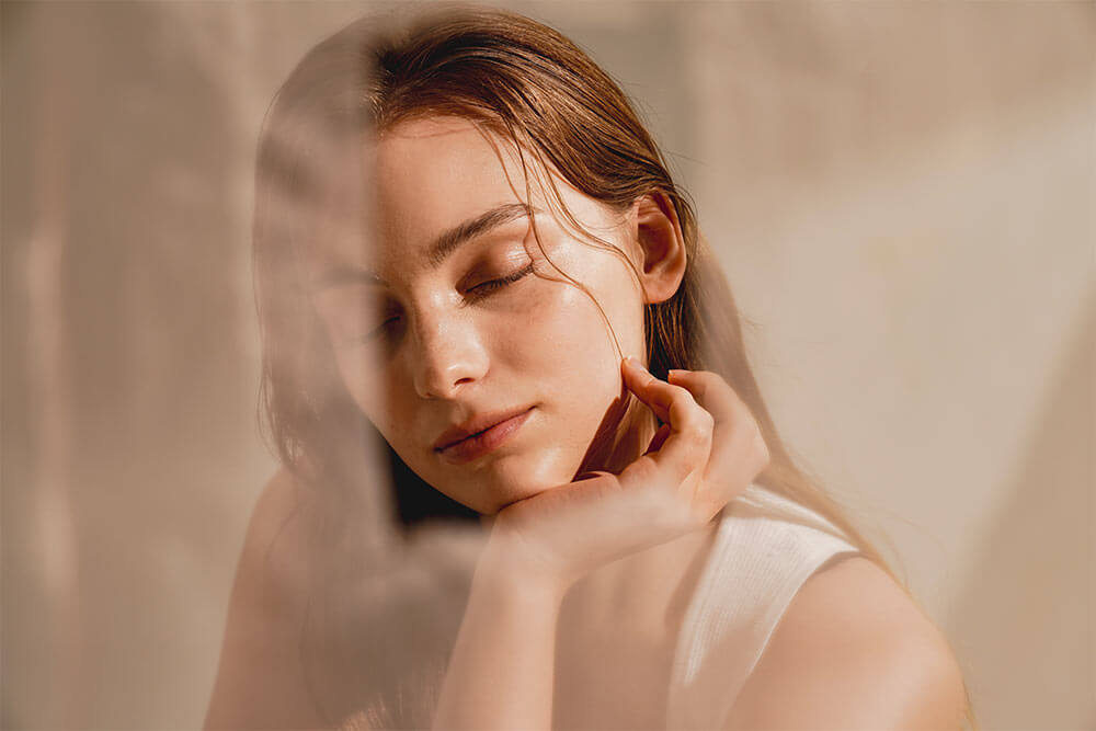 Young beautiful woman with closed ayes