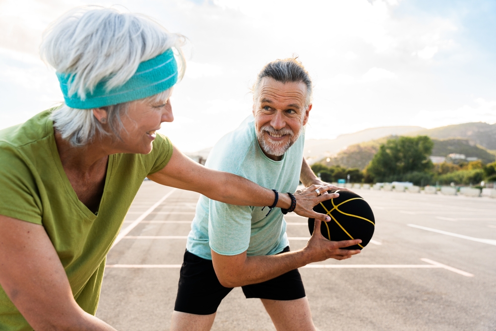 active people playing basketball