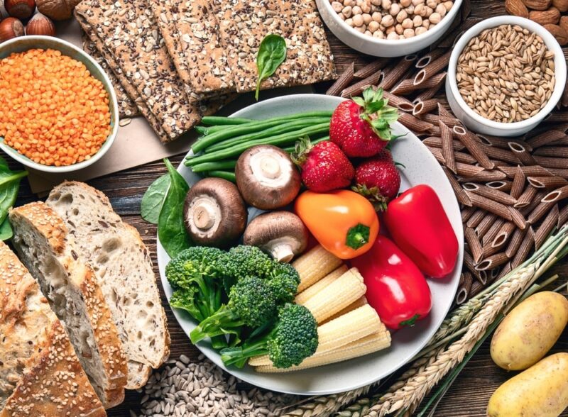 Healthy high fiber diet eating concept with antioxidants and vitamins on a wooden backgrund. Top view.