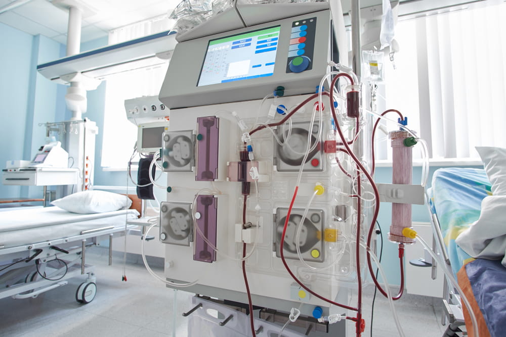 Working hemodiafiltration machine at intensive care department. Patient in critical stance with renal failure