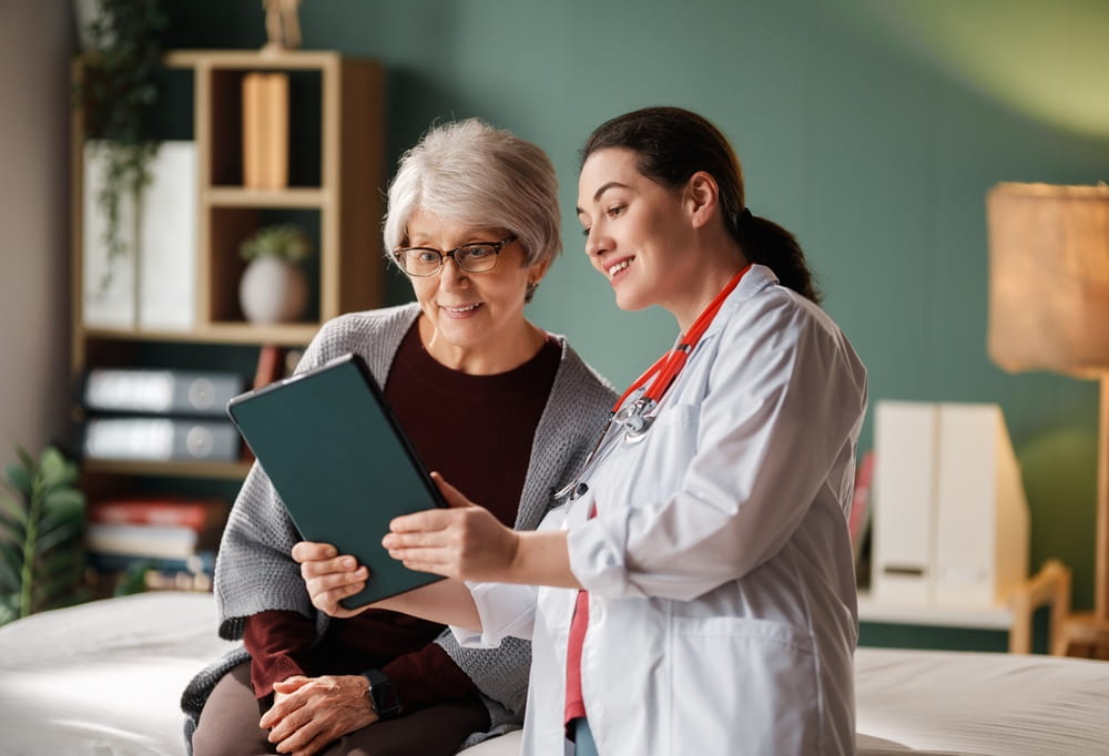 Female patient listening to a doctor in hospital.
