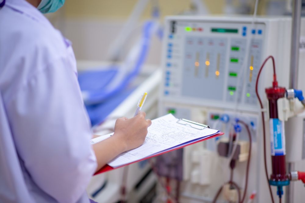 The specialist are checking continuous renal replacement therapy equipment and injection pump and hemodialysis machine.