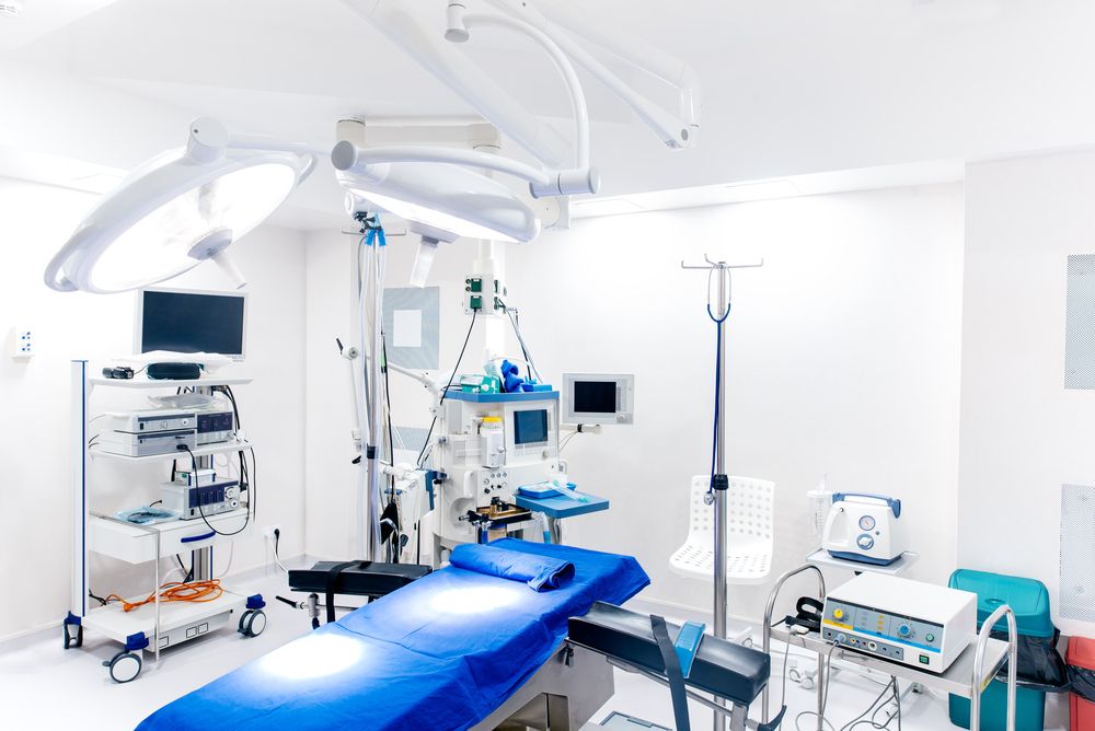 Medical devices and industrial lamps in surgery room of modern hospital.