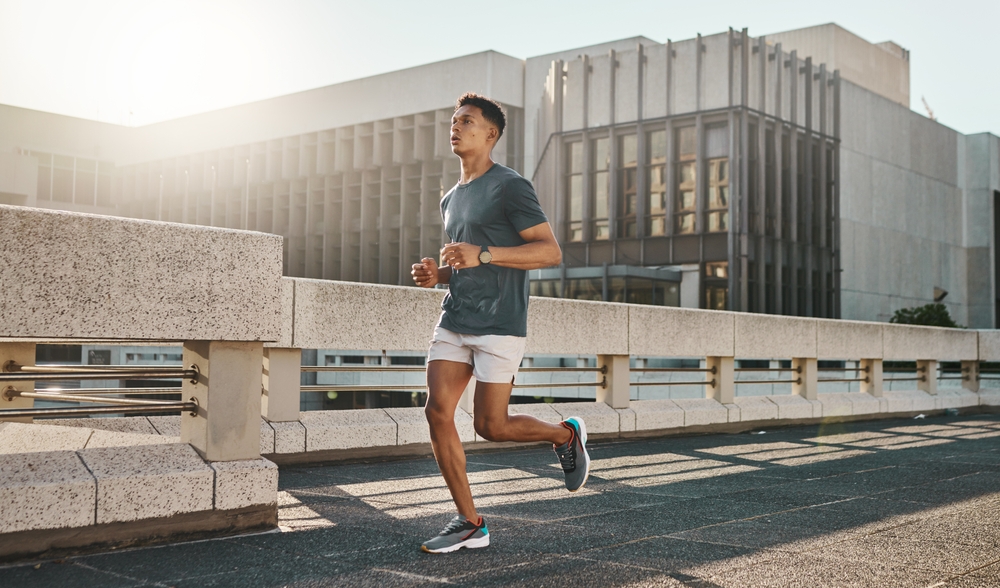 Man running on street with motivation