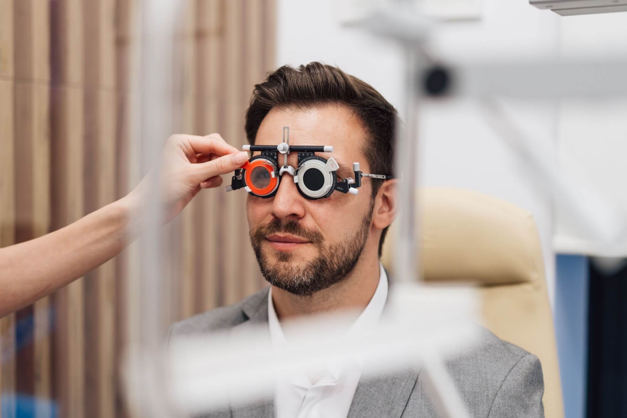 Doctor using adjustable optical trial lens frame